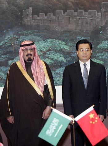 King Abdullah (centre left) and Chinese President Hu Jintao (centre right) stand with officials at a signing ceremony at the Great Hall of the People in Beijing Monday (EPA)