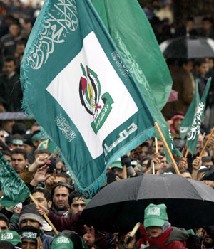 Palestinian supporters of Hamas, winners of the Palestinian elections wave green Islamic flags following Friday noon prayers at The "Dome of the Rock" in the al-Aqsa mosque compound 27 January, 2006 (AFP)
