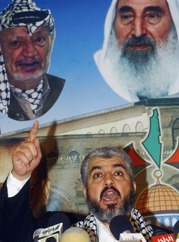Hamas political leader Khaled Mashaal, whose group achieved a resounding victory in Palestinian elections this week, speaks at a news conference in Damascus, Syria (AP)