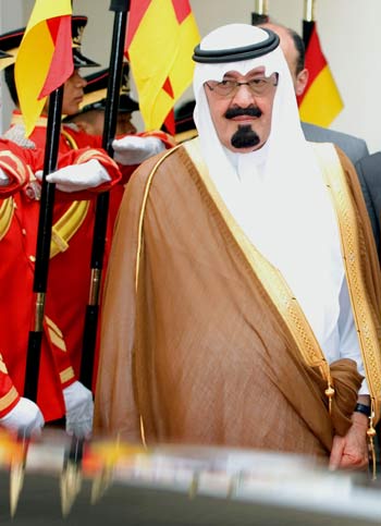 Saudi Arabia's King Abdullah Abdul Aziz Al-Saud walks past the guard of honor after the welcoming ceremony at the Parliament house in Kuala Lumpur, Malaysia (AP)