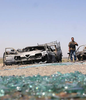 Shattered glass litters the street where a car bomb exploded in the Al-Sada region near Baquba (AFP)