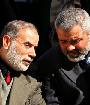 Hamas leaders Ismail Haniyeh and Ahmed Bahar (L) gather after their meeting with Jordan's ambassador Yehya Al-Qarala in Gaza January 31, 2006 (REUTERS)