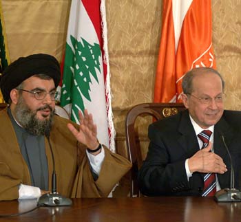 Hezbollah leader Sheik Hasan Nasrallah, left, and Lebanese Christian legislator Michel Aoun. (AP)