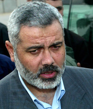 Senior Hamas leader Ismail Haniyeh talks to reporters upon his return from Egypt 09 February 2006, at the Rafah border terminal in the southern Gaza Strip (AFP)