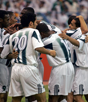 Saudi players celebrate after scoring their second goal against Uzbekistan during the soccer 2006 World Cup Asian qualifying round in Riyadh (REUTERS)