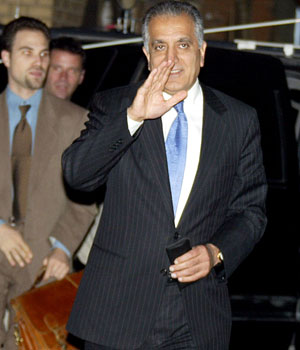 US ambassador to Iraq Zalmay Khalilzad waves as he arrives at a meeting for Iraqi political leaders, 20 February 2006 at the Iraqi President Jalal Talabani's residence in Baghdad, Iraq (AFP)