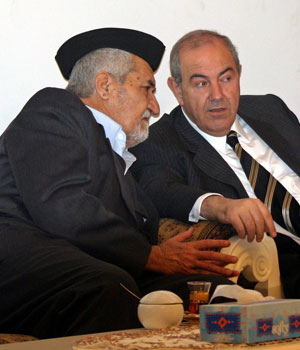 Sunni Arab leader Adnan al-Dulaimi (L) speaks with Iraqi former Prime Minister Iyad Allawi (R) during a meeting of Iraqi political leaders in Baghdad February 20, 2006 (REUTERS)