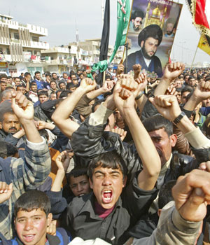 Angry Iraqi Shiites demonstrate in Baghdad's poor neighborhood of Sadr City to protest against the bombing of the holy shrine of al-Hadi in the Iraqi northern city of Samarra, 22 February, 2006 (AFP)