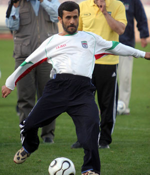 Iranian President Mahmoud Ahmadinejad joins the Iranian national soccer team as they practise for a world cup friendly match against Costa Rica in Tehran, Iran, February 28, 2006 (REUTERS)