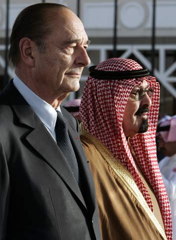 French President Jacques Chirac, and King Abdullah bin Abdulaziz Al Saud listen to the national anthems upon his arrival at Riyadh airport (AP)