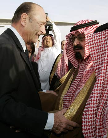 French President Jacques Chirac, is welcomed by Abdullah bin Abdulaziz upon his arrival at Riyadh airport for a three-day official visit (AP)
