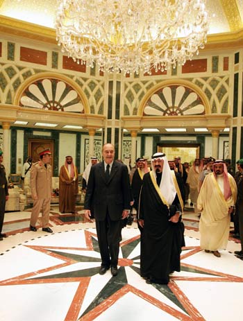 King Abdullah bin Abdulaziz, and French President Jacques Chirac walk to dinner at the Royal Palace, in Riyadh (AP)