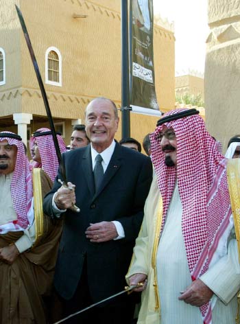 French President Jacques Chirac and King Abdullah bin Abdulaziz hold swords as they watch a traditional dance in Riyadh (AP)
