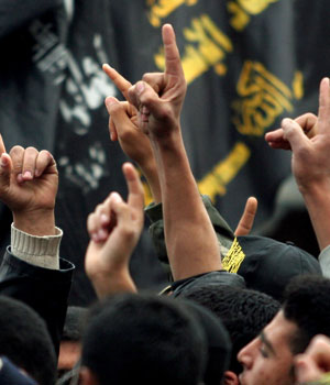 Palestinian supporters of Islamic Jihad chant slogans during a rally in Gaza City, March 10, 2006 (AP)