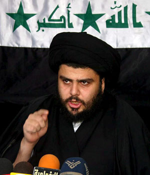 Iraq's radical Shi'ite cleric Moqtada al-Sadr holds a press conference in the holy city of Najaf, south of Baghdad, 13 March 2006 (EPA)