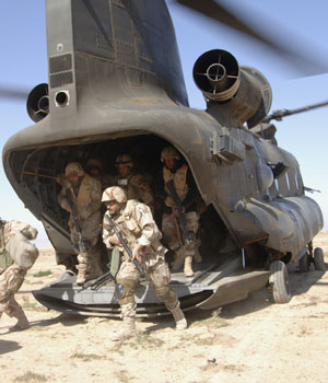 Iraqi soldiers from 4th Iraqi Army Division get off a CH-47 Chinook helicopter during Operation Swarmer, an assault operation with the combined U.S. and Iraqi forces targetting insurgents near Samarra, March 16, 2006 (REUTERS)