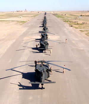 Iraqi Soldiers from the 101st Combat Aviation Brigade, 101st Airborne Division stand ready with a staged row of Blackhawk helicopters in preparation for Operation Swarmer, in Remagen, Iraq, March 16 2006 (AP)
