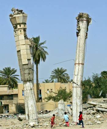 Iraqi children play among the ruins of the destroyed Iraqi Air Force Club (AFP)
