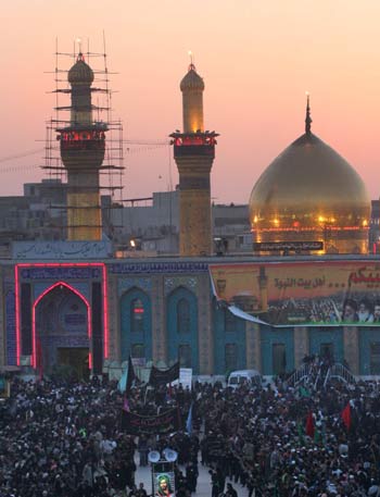 Iraqi Shiites Muslims flagellate themselves with chains, during a procession, in front of Imam Hussein's shrine (AP)