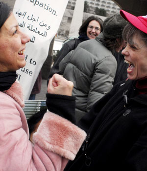 Christian Peacemaker Teams supporters celebrate the release of their friends and colleagues who were held hostage in Iraq for the past four months, 23 March, 2006, Toronto, Canada (AFP)
