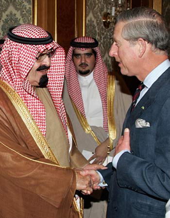 King Abdullah welcomes Britain's Prince Charles and his wife Camilla in Riyadh (R)