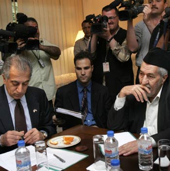 U.S. ambassador to Iraq Zalmay Khalilzad, left, with leader of the largest Sunni bloc Adnan al-Dulaimi (AP)