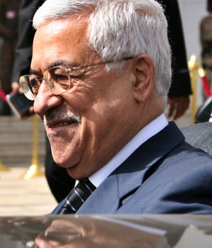 Palestinian President Mahmoud Abbas leaves at the end of the second day of the Arab summit in Sudan's capital Khartoum, March 29 2006 (REUTERS)