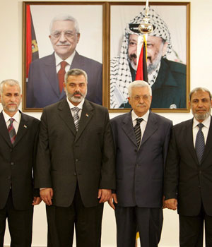 Hamas formally took power 29 March 2006, with the Palestinian president swearing in its 24-member Cabinet, including 14 ministers who served time in Israeli prisons (AP)