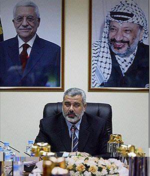 Palestinian Prime Minister Ismail Haniya chairs the first cabinet meeting since Hamas assumed power, in Gaza City (AFP)