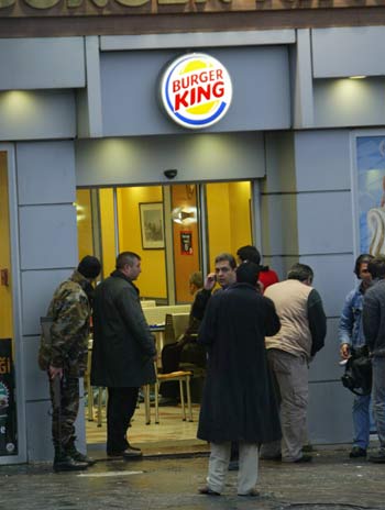 Police stand outside a Burger King restaurant on Taksim Square In central Istanbul, Turkey (AFP)