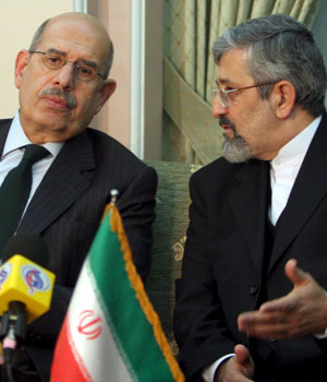 International Atomic Energy Agency (IAEA) head Mohamed ElBaradei (L), speaks with Iran's ambassador to the IAEA, Aliasghar Soltaniyeh, at Tehran's Mehrabad airport 13 April, 2006 (AFP)