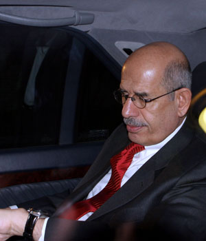 Mohamed ElBaradei, head of the IAEA, looks at his watch as he leaves at the conclusion of a meeting and a joint press conference with Iran's top nuclear negotiator, Ali Larijani, unseen, in Tehran, Iran, April 13, 2006 (AP)