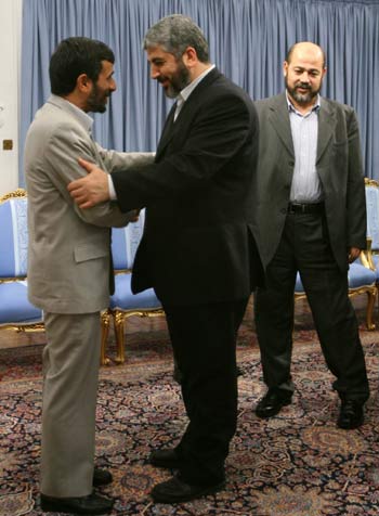 Iranian President Mahmoud Ahmadinejad meets with Palestinian Hamas leaders, khaled Meshaal and Mussa Abu Marzuq in Tehran (R)