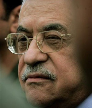 Palestinian Authority President Mahmoud Abbas briefs the media outside his residence in the West Bank town of Ramallah, Monday, April 17, 2006 (AP)