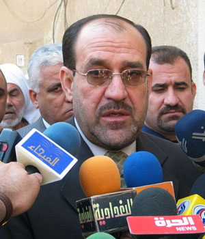 Iraqi Prime Minister-designate Nuri al-Maliki speaks to reporters in the holy Iraqi city of Najaf, April 27, 2006 (REUTERS)