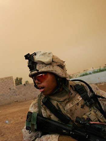 A U.S. runs during a patrol in Karmah, 80 kilometers, 50 miles, west of Baghdad, Iraq, Monday, April 24, 2006 (AP)