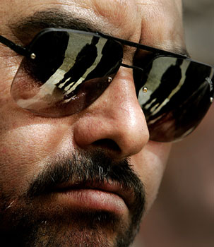 The governor of Iraq's volatile Anbar province, Maamoun Sami Rashid al-Alwani, escaped with minor injuries when a roadside bomb exploded near his convoy, Tuesday 2 May 2006 (AP)