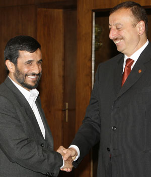 Iranian President Mahmoud Ahmadinejad, left, and Azerbaijani President Ilham Aliev shake hands at a summit of the the Economic Cooperation Organization in Baku, Azerbaijan, Friday, May 5, 2006 (AP)
