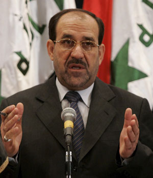Designated Iraqi Prime Minister Nuri al-Maliki gestures during a press conference 9 May 2006. He said he expected to be able to form a national unity government within the next couple of days (EPA)