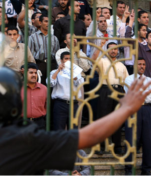 Protesters shout in front of a mosque during a protest in Cairo, May 11, 2006 (REUTERS)