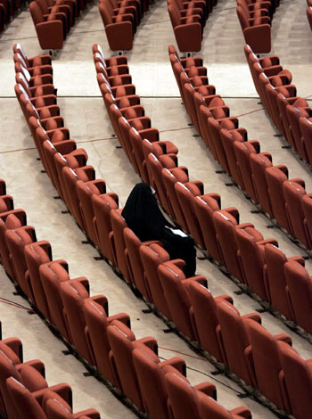 An Iraqi female parliamentary member waits for the parliament session to start (EPA)