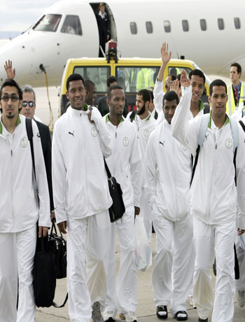 Saudi Arabia's national football team members wave upon their arrival at Frankfurt/Main's airport (AFP)
