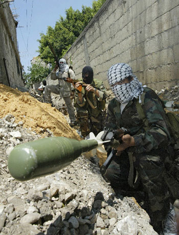 Palestinian Fatah guerrillas take position in the refugee camp of Ain el-Hilweh near Sidon (AFP)