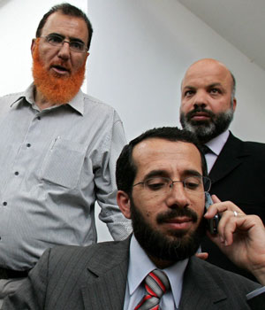 Palestinian Hamas lawmakers (from R-L) Mohammed Abu Tir, Khaled Abu Arafeh and Mohammed Totah talk to the media at the Palestinian Legislative Council building in the West Bank city of Ramallah May 30, 2006 (REUTERS)