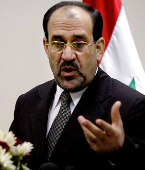 Iraqi Prime Minister Nouri al-Maliki gestures during a press conference in Baghdad, Iraq, June 1, 2006 (AP)
