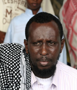 This 02 June 2006 picture shows the chairman of the Mogadishu Joint Islamic court Sheikh Sharif Sheikh Ahmed posing in his head quarters in southern Mogadishu, Somalia (AFP)