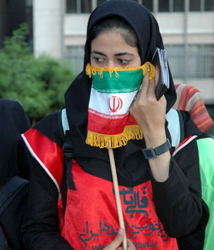 An Iranian woman supporting presidential candidate Mohamad Baqer Qalibaf at a rally in downtown Tehran, 15 June 2005 (EPA)