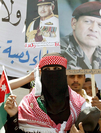 A Jordanian woman during a protest against the visit last week of four Islamic Action Front party deputies to the wake of Abu Musab al Zarqawi, in Amman (EPA)