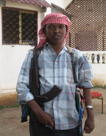 20-year-old gunman from the Islamic Courts Union militia poses with gun outside the group's headquarters in Mogadishu, (KRT)