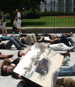 Activists lie on the ground in front of the White House during a demonstration against the war in Darfur (Asharq Al Awsat photo)